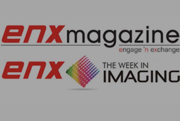 Logos for enx magazine with the tagline engage n exchange and enx THE WEEK IN IMAGING, featuring a colorful, diamond-shaped pixel graphic between enx and IMAGING on a gray background—highlighting Jodie Grice, VP of Customer Service at GoodSuite.