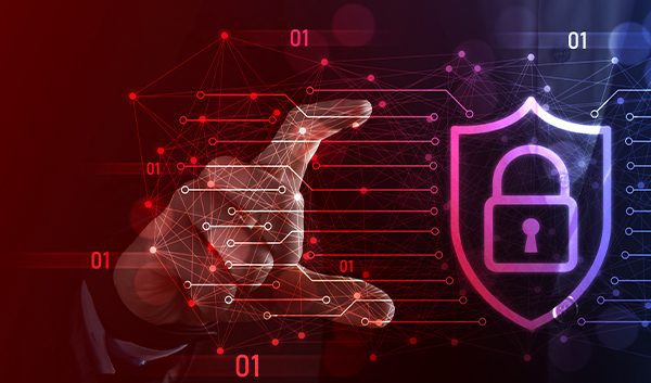 A person’s hands frame a glowing digital shield with a padlock icon, symbolizing small business cyber security. Blue and red binary code and network lines surround the shield, highlighting efforts to protect small businesses from cyber attacks.