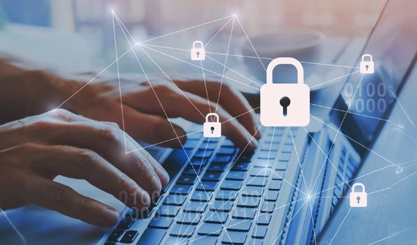 Hands typing on a laptop keyboard with digital padlock icons and network lines overlayed, representing business cybersecurity and data protection in a secure business network.