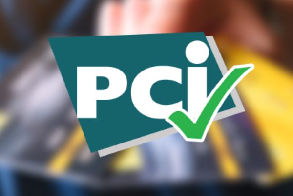 A blurred image of a person holding credit cards, overlaid with the PCI DSS logo and a green checkmark, suggesting Payment Card Industry compliance or security approval.