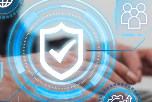 Hands typing on a laptop keyboard with digital icons overlayed, including a shield with a checkmark, graphs, people, and technology symbols, representing cybersecurity, Print security, and data protection concepts.