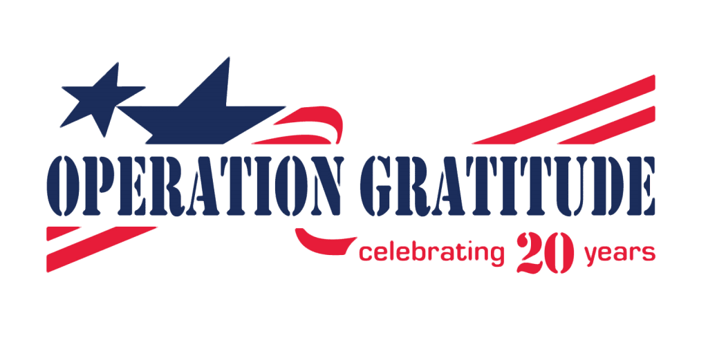 OG_20thAnniversaryLogo Logo for Operation Gratitude with blue and red patriotic elements, including a star, stripes, and the text celebrating 20 years in red next to OPERATION GRATITUDE in blue stencil lettering.