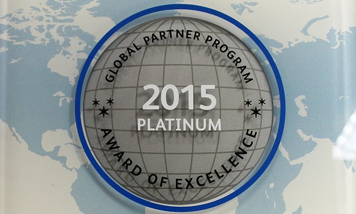 Platinum-Award-of-Excellence A round silver and blue plaque reads GoodSuite Global Partner Program 2015 Platinum Award of Excellence against a world map background.