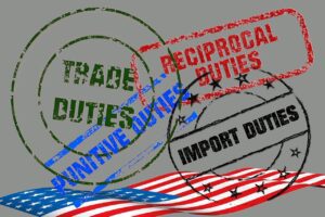 An image with overlapping rubber stamp marks reading “TRADE DUTIES,” “RECIPROCAL DUTIES,” “IMPORT DUTIES,” and “PUNITIVE DUTIES” above a stylized American flag on a gray background, highlighting the tariffs and industry impact.