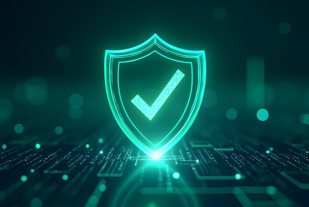 A glowing digital shield with a check mark in the center poses the question: is antivirus enough for small business? Set against a dark background with circuitry and light effects, it symbolizes cybersecurity or data protection.