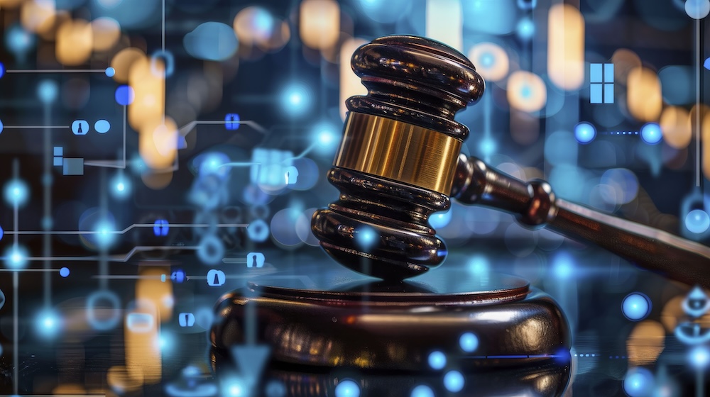 A judge’s gavel rests on a sound block, surrounded by glowing blue digital symbols and abstract circuitry, symbolizing the intersection of law and technology in a world of privacy compliance.